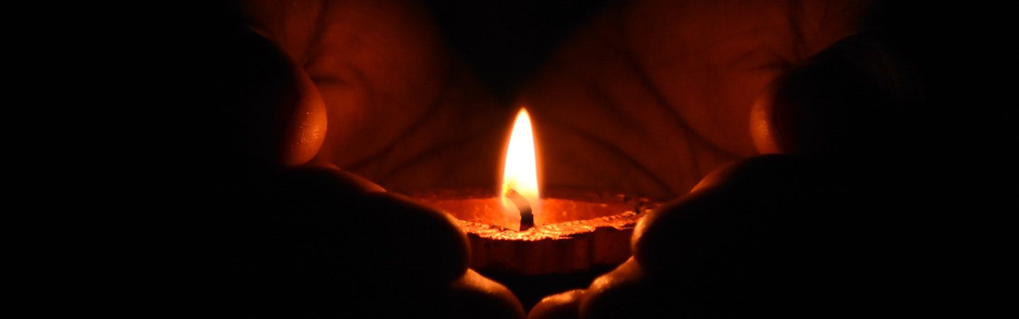 tea light candle being held